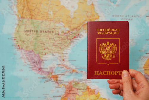 Russian federation passport in front of USA map.