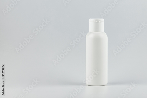 cosmetic flacon tube on white background. white unbranded cosmetic flacon mock up. branding identity flacon mockup concept. blank label