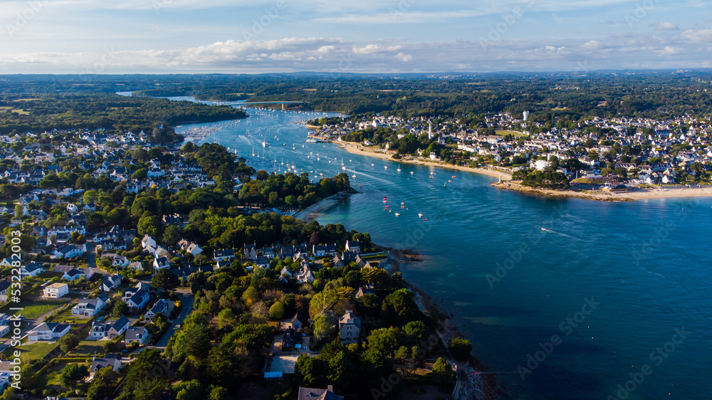 Aerial view of the mouth of the river Odet in Bénodet, a seaside resort town in Finistère, France - Sailboats heading into the Atlantic Ocean in the south of Brittany