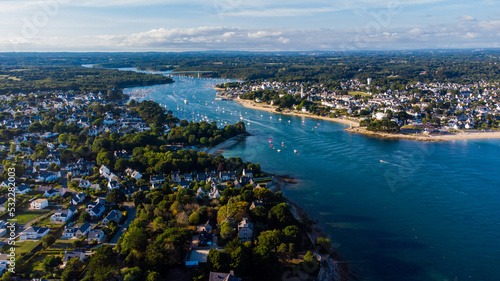 Aerial view of the mouth of the river Odet in Bénodet, a seaside resort town in Finistère, France - Sailboats heading into the Atlantic Ocean in the south of Brittany photo