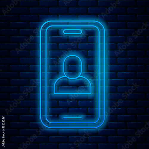 Glowing neon line Video chat conference icon isolated on brick wall background. Online meeting work form home. Remote project management. Vector