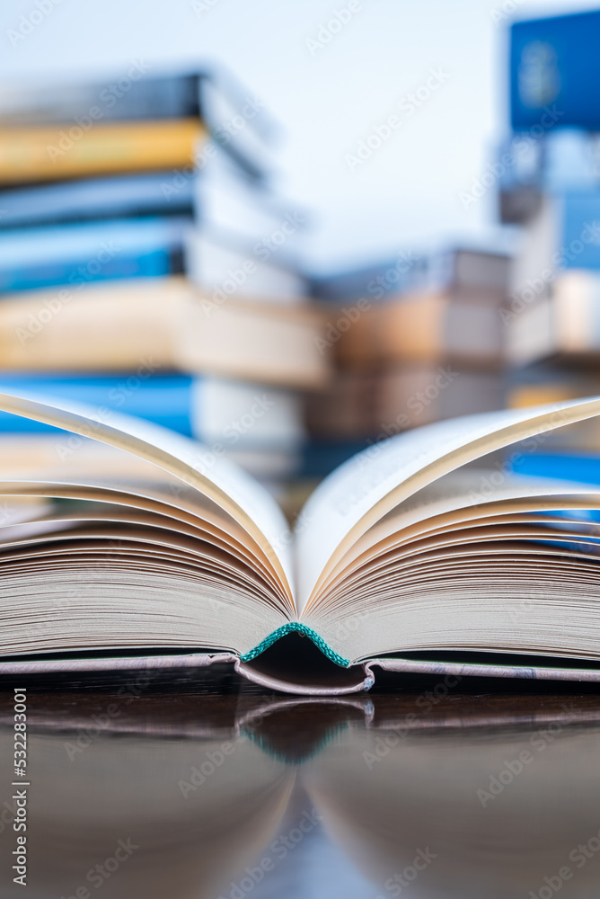 Closeup opened book on library desk Closeup opened book on library desk