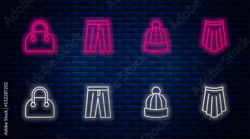 Set line Pants, Winter hat, Handbag and Skirt. Glowing neon icon on brick wall. Vector