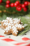 Christmas decoration. Christmas tree branches and homemade decorated Christmas cookies, close up image.	
