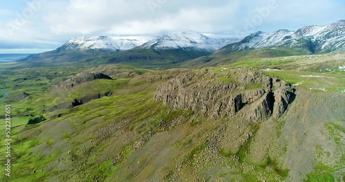 Perfect combination of grassy and snowy mountain summits. photo