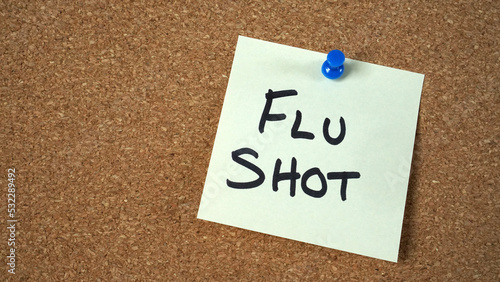Sticky note reminder to get flu shot