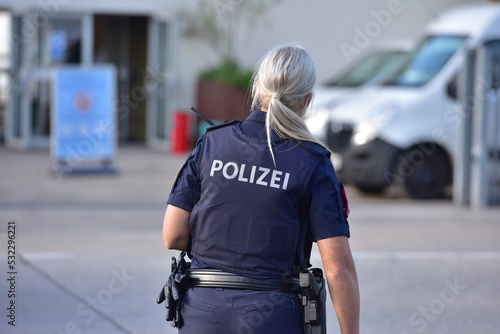 Photography Policewoman in Austria from behind