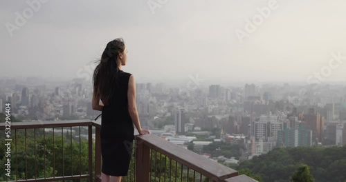 Woman look at the city view photo
