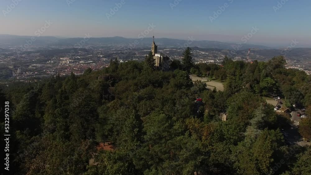 Flying Over Mountain and Sanctuary of Penha. Guimarães, Portugal 4k. Travel Destination. Nature Landscape. Church in Mountain Forest. Summer Day. Flying Over Mountain and Sanctuary of Penha. Guimarães, Portugal 4k. Travel Destination. Nature Landscape. Church in Mountain Forest. Summer Day.