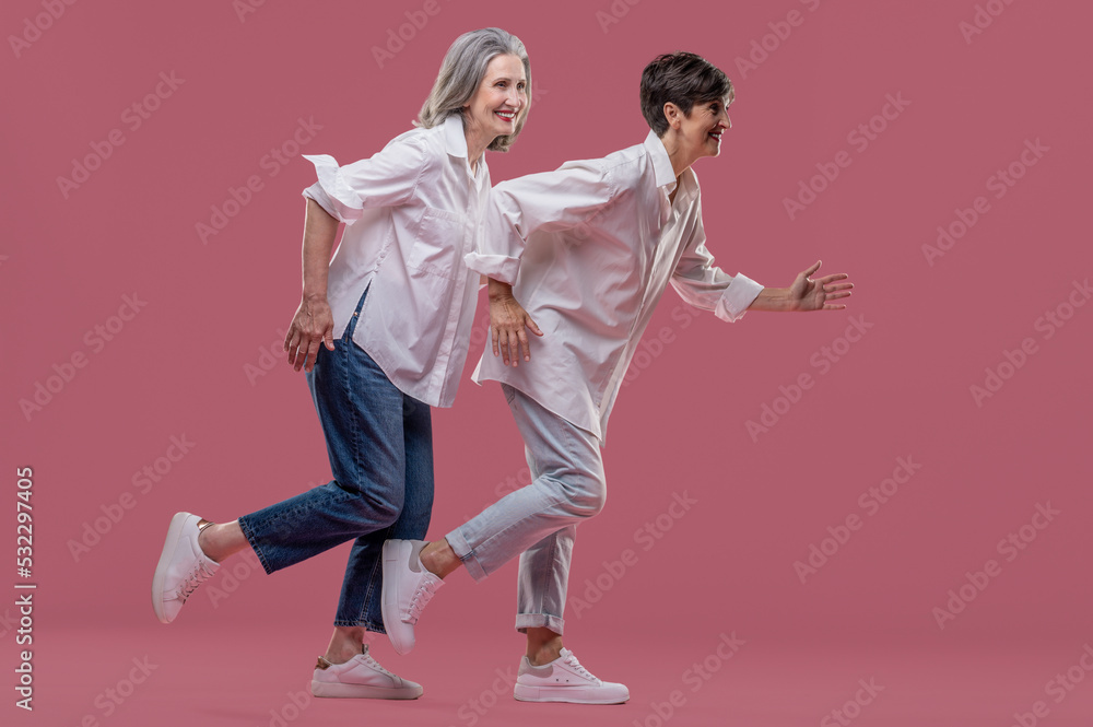 Women feeling playful and joyful while spending time together Women feeling playful and joyful while spending time together