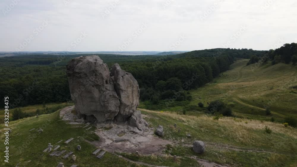 Aerial panoramic view of the giant stone located in Pidkamin western Ukraine, drone flies forward Aerial panoramic view of the giant stone located in Pidkamin western Ukraine, drone flies forward