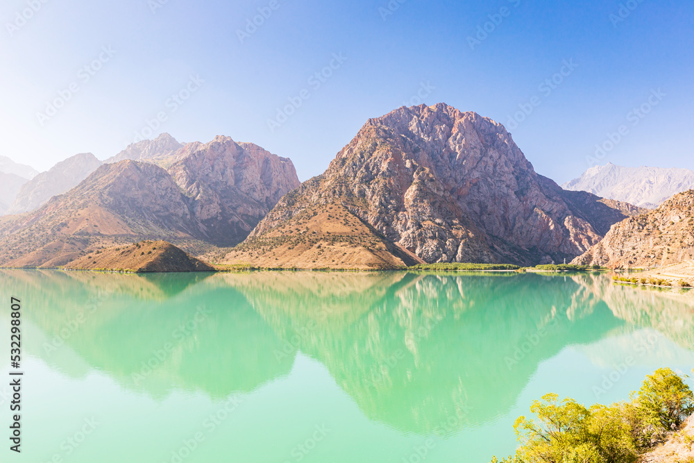 Iskanderkul, Sughd Province, Tajikistan. Mountains and blue sky above Iskanderkul Lake.
