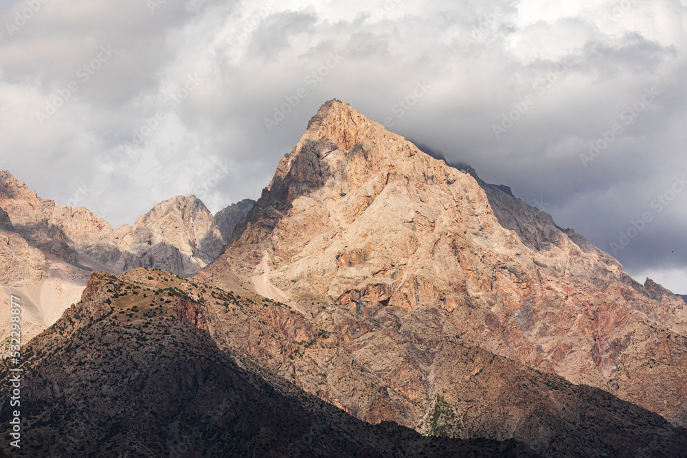 Anzob, Aughd Province, Tajikistan. High mountains and clouds in dramatic light.