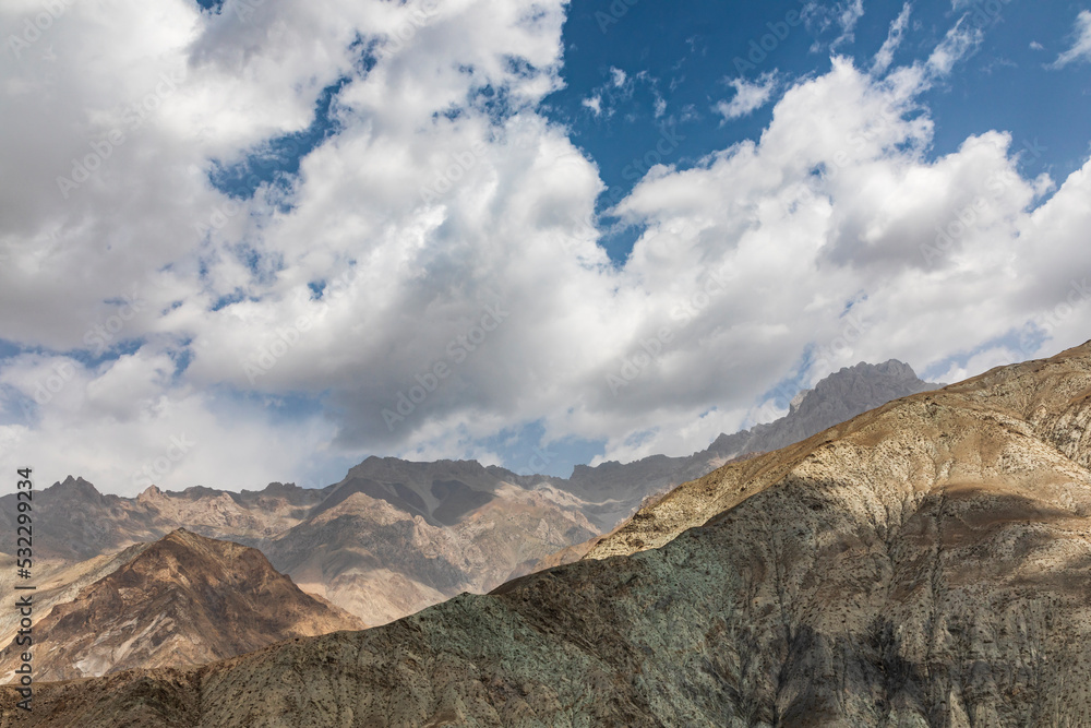 Takfon, Sughd Province, Tajikistan. Clouds over arid mountains in Tajikistan.