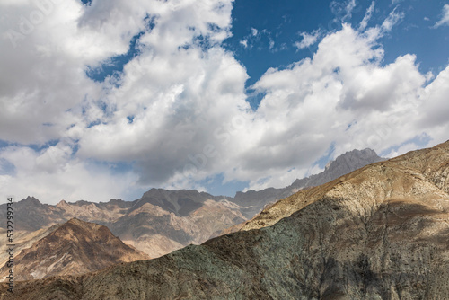 Takfon, Sughd Province, Tajikistan. Clouds over arid mountains in Tajikistan.