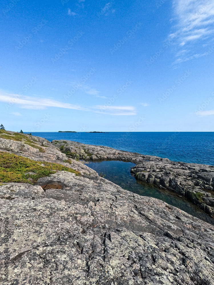 Unspoiled Views of Lake Superior and Natures Beauty. Standing on a rock basin at the Northern most edge of the United States, looking out over the vast expanse of Lake Superior. Isle Royal NP.