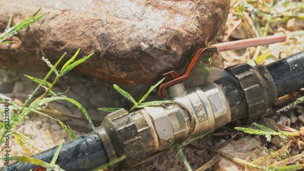 Water flows out of the metal connecting joint between the rubber hoses