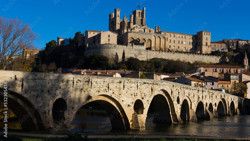 Pont Vieux and Cathedral of Saint Nazaire in sunny autumn day, Beziers, France.