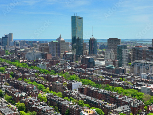 Boston Back Bay modern city skyline aerial view including John Hancock Tower and Trinity Church at Copley Square in Boston, Massachusetts MA, USA.   photo