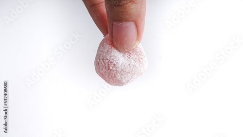 Mochi, Japanese Dessert hold by hands. In Indonesia Popular as Moaci or Mochi Sukabumi. photo