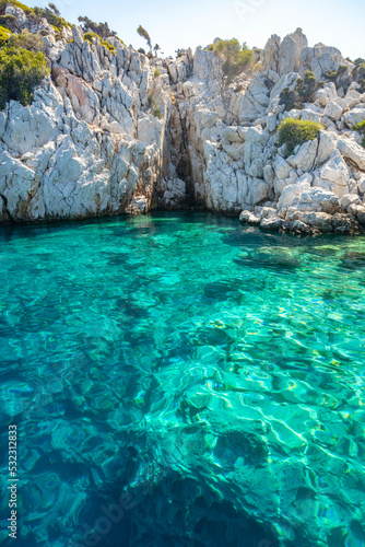 Turquoise colored crystal clear water at a rocky island, Aegean Sea, Turkey © Danita Delimont