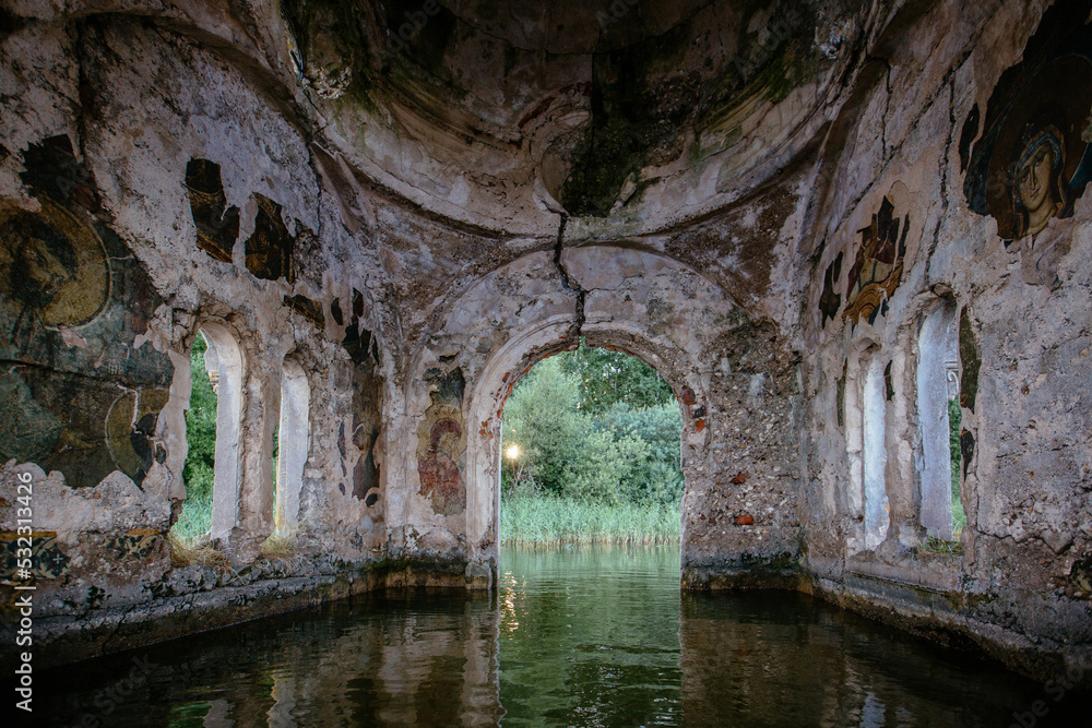 Large flooded hall of ruined abandoned church