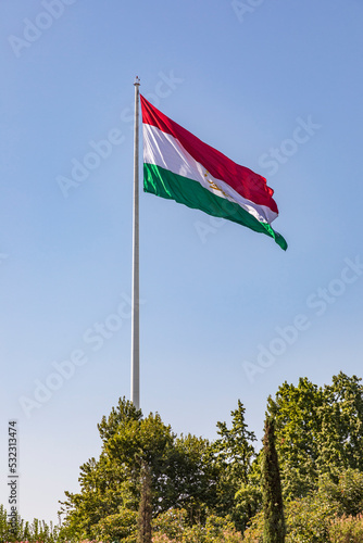 Dushanbe, Tajikistan. Tajik flag flying in Rudaki Park.