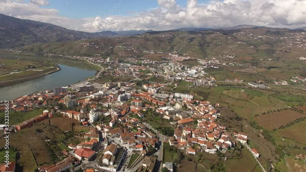 Aerial View City of Peso da Régua and River Douro. Portugal 4k. Beautiful Nature Landscape with Mountains Vineyards. Travel Destination Aerial View City of Peso da Régua and River Douro. Portugal 4k. Beautiful Nature Landscape with Mountains Vineyards. Travel Destination