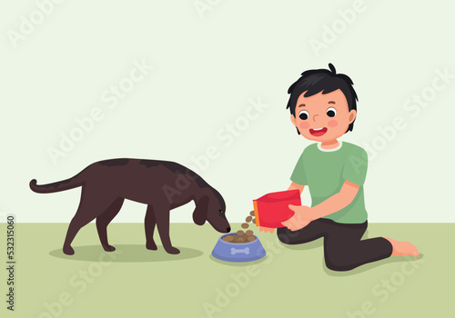 cute little boy feeding his dog pet with animal food