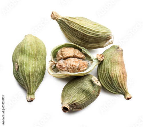 Dry green cardamom pods on white background, top view