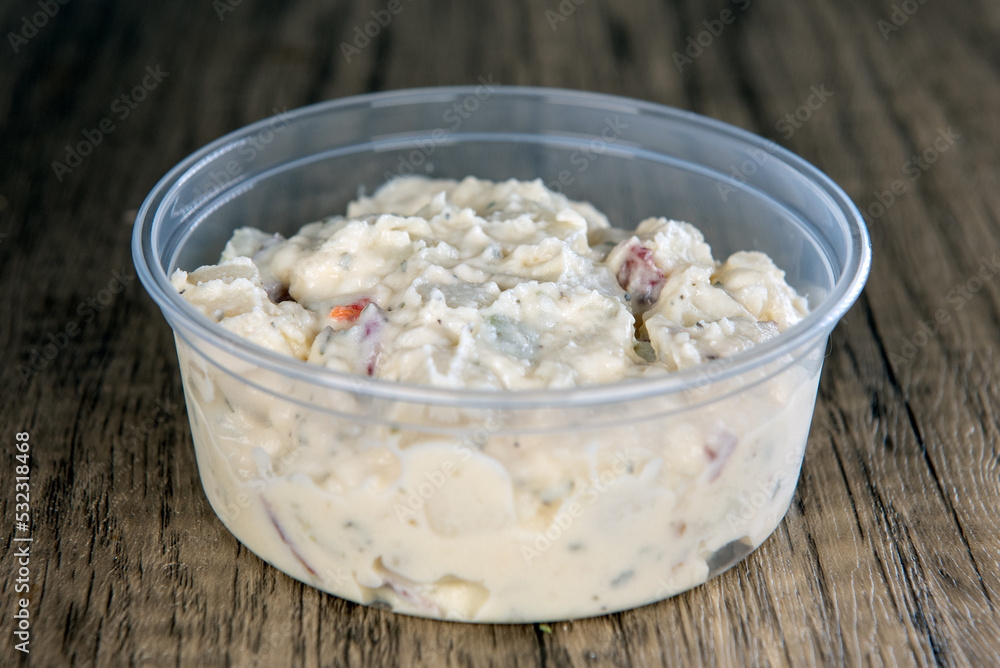 Lunch is complimented with a side order of German Potato salad in a resuable container Lunch is complimented with a side order of German Potato salad in a resuable container