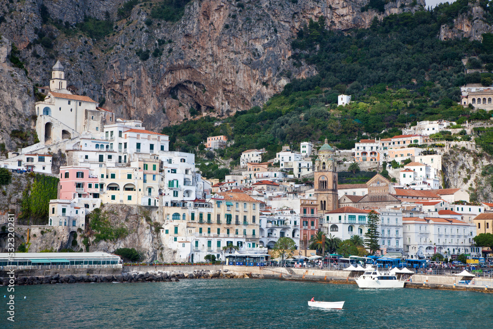 Italy, Amalfi. The coastal town of Amalfi as seen from a boat in the harbor.