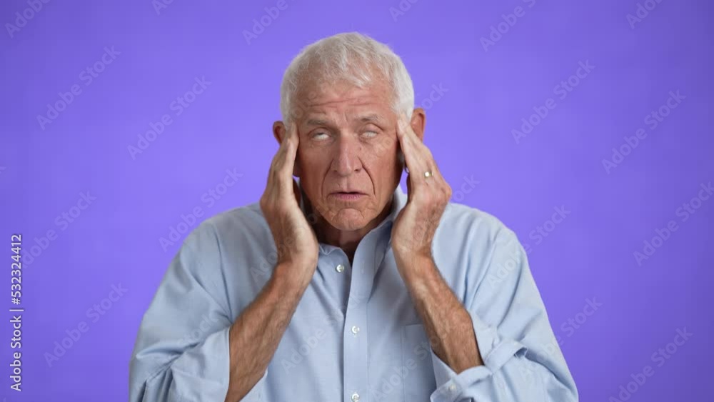 Sick ill tired elderly gray-haired man with headache 70s wears blue shirt rub head suffer from migraine feel bad seedy isolated on plain light purple background studio portrait Sick ill tired elderly gray-haired man with headache 70s wears blue shirt rub head suffer from migraine feel bad seedy isolated on plain light purple background studio portrait
