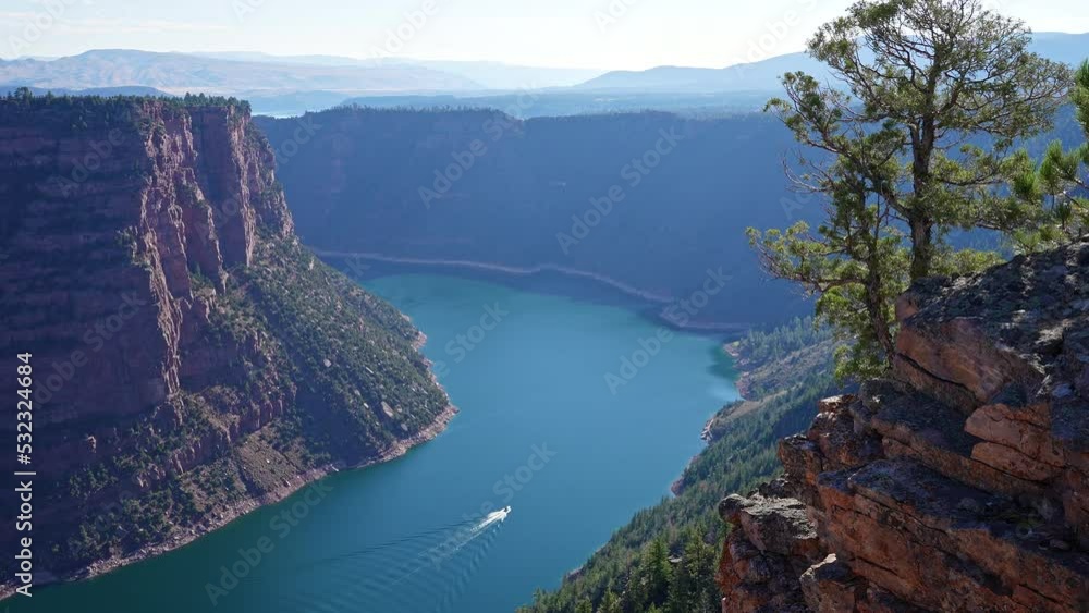 Flaming Gorge with boat in the Green River at Red Canyon overlook on sunny day in Utah. Flaming Gorge with boat in the Green River at Red Canyon overlook on sunny day in Utah.