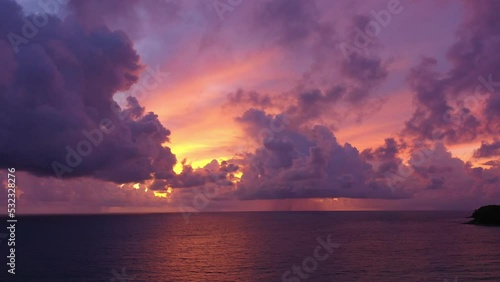 colorful light through to the cloud above the ocean..Clouds are moving slowly in stunning sunset video 4K. Nature video High quality footage .Scene of Colorful romantic sky sunset background.. photo