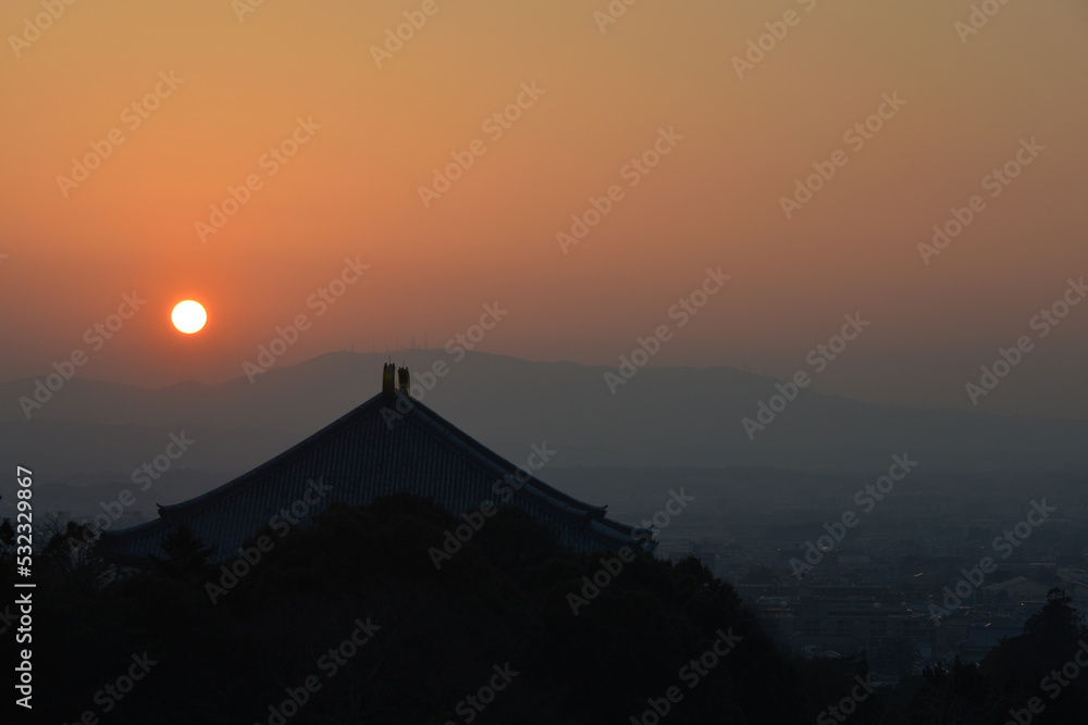 sunset over the mountains from Todai-ji temple sunset over the mountains from Todai-ji temple