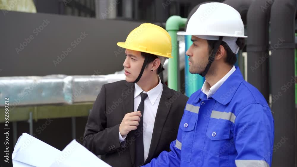 Foreman and construction manager talking - discussing about building structure plant. Foreman and construction manager talking - discussing about building structure plant.