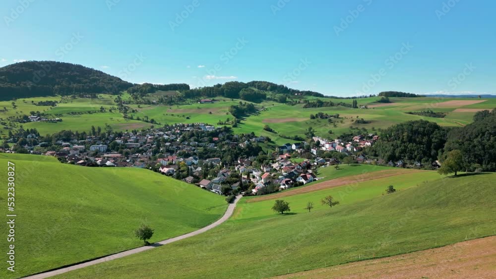 Aerial view of a village from Switzerland. The village is called Niederdorf. Aerial view of a village from Switzerland. The village is called Niederdorf.