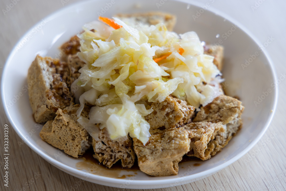 Famous Taiwanese snack of stinky tofu on the table Famous Taiwanese snack of stinky tofu on the table