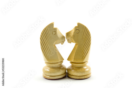 A pair of amorous chess horses stare at each other with love. © Bayu