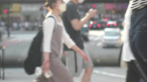 Wallpaper Mural SHIBUYA, TOKYO, JAPAN - AUG 2022 : View of crowd of people at the street. Pedestrian walking at the zebra crossing near Shibuya scramble crossing. Japanese urban downtown city life style concept video Torontodigital.ca
