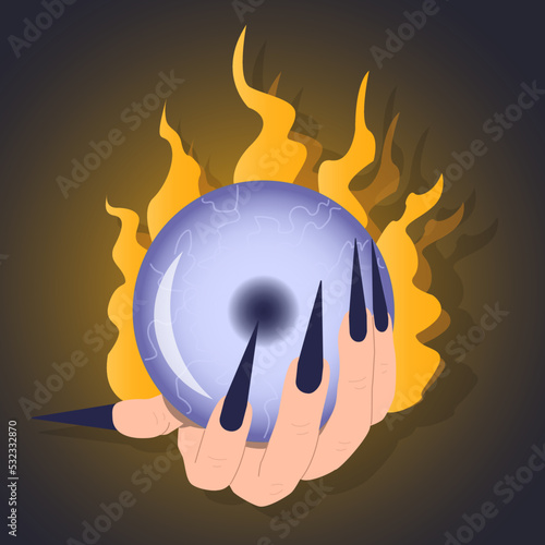 Magic ball in witch's hand on fire