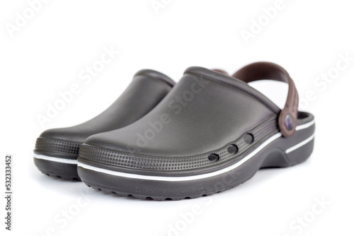 Black rubber sandals covering toes isolated on white background