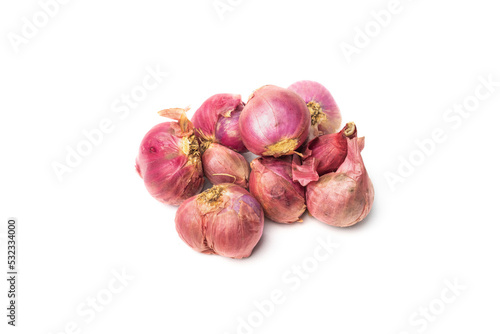 close up of ripe or raw shallots with skin isolated on white background