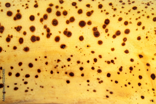 Yellow color, banana texture - micro image. Texture of ripe organic banana closeup