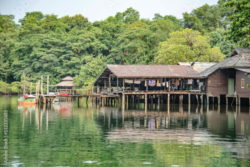 Houses along the canal out to the sea in the mangrove forest on Koh Kood, Trat Province, Thailand.