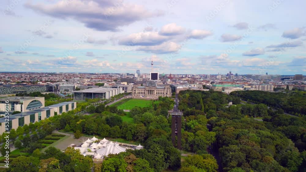 bell tower in Tiergarten. Wonderful aerial view flight panorama curved drone Reichstag in Government district Berlin Germany at summer day 2022. 4k Cinematic from above bell tower in Tiergarten. Wonderful aerial view flight panorama curved drone Reichstag in Government district Berlin Germany at summer day 2022. 4k Cinematic from above