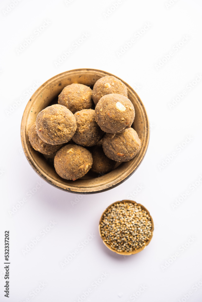 Bajra Atta Ladoo or kuler laddoo - Millet Flour Laddu, a popular winter sweet snack food from India Bajra Atta Ladoo or kuler laddoo - Millet Flour Laddu, a popular winter sweet snack food from India