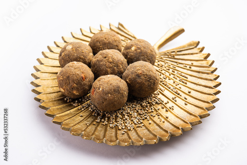 Bajra Atta Ladoo or kuler laddoo - Millet Flour Laddu, a popular winter sweet snack food from India photo