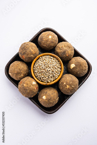 Bajra Atta Ladoo or kuler laddoo - Millet Flour Laddu, a popular winter sweet snack food from India photo